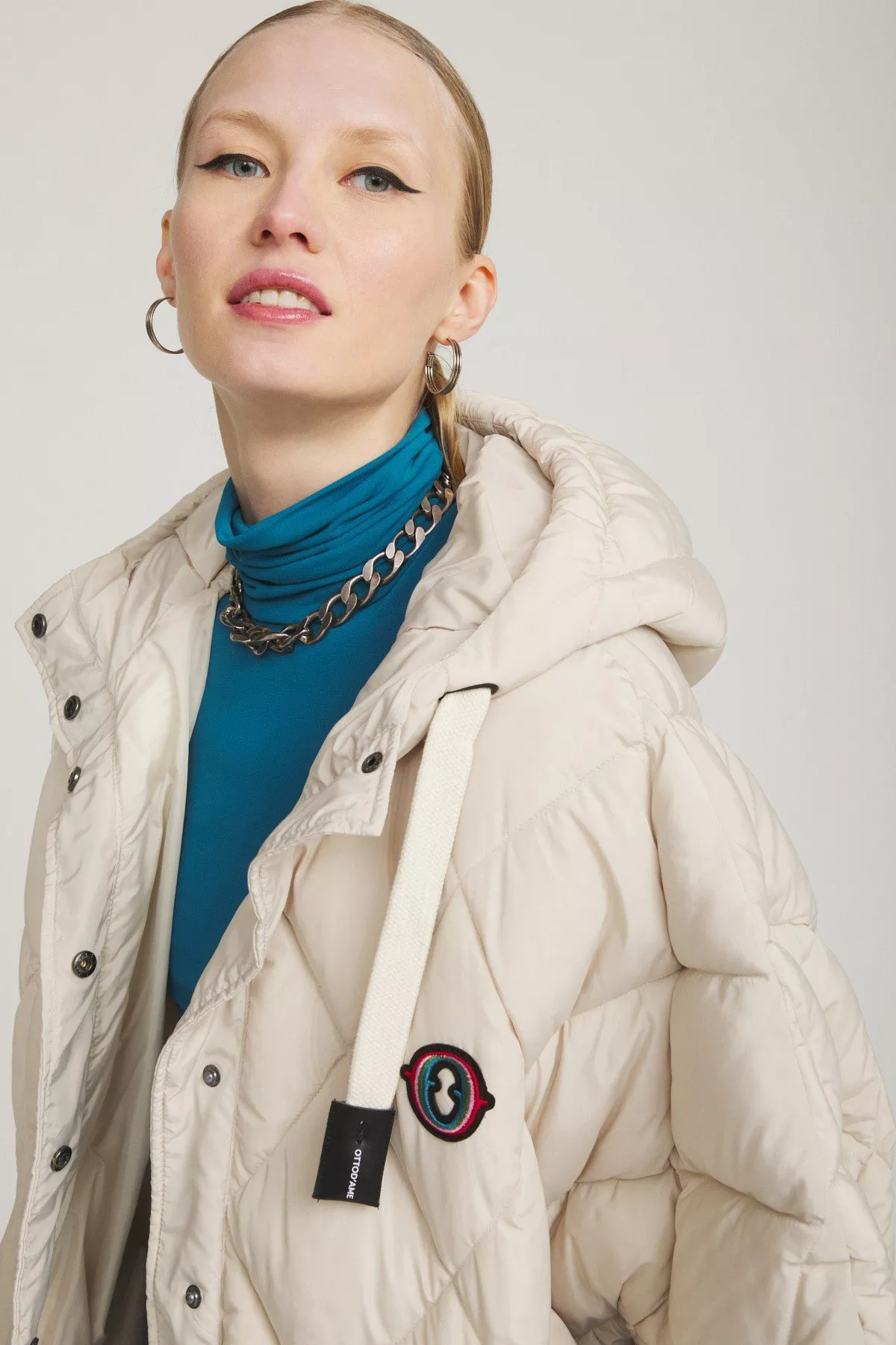 Cape-style puffer jacket